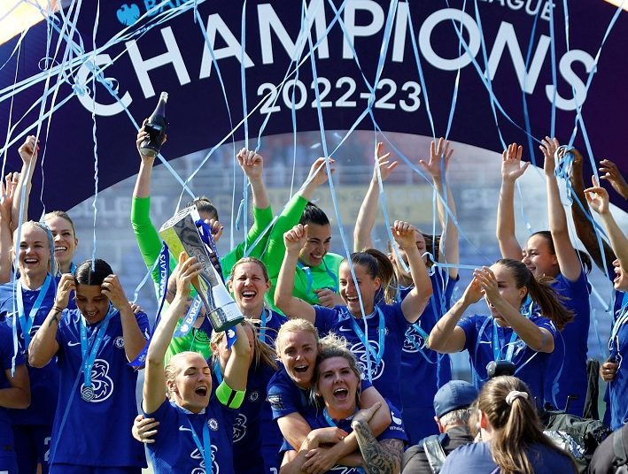 Chelsea's players celebrate with the trophy after winning the Women's Super League Action on May 27, 2023.