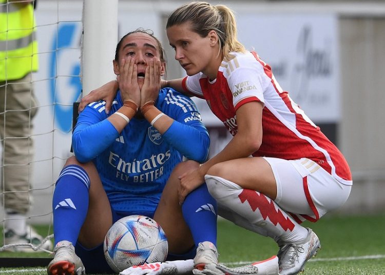 Arsenal’s goalkeeper Manuela Zinsberger is consoled by Cloe Lacasse after the club fell at the qualifying stages of the Champions League.