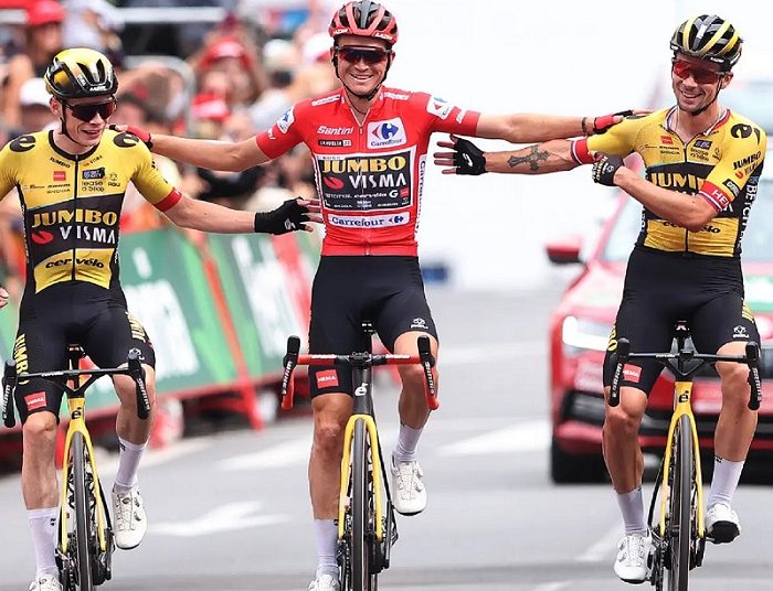 Kuss crowned Vuelta champion 1 - Egyptian Gazette Sepp Kuss (C) is flanked by Jonas Vingegaard (L) and Primoz Roglic as they cross the line to finish stage 20.