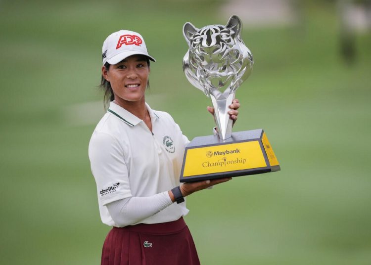 Celine Boutier of France celebrates with the trophy after winning the LPGA Maybank Championship in Kuala Lumpur, Malaysia.