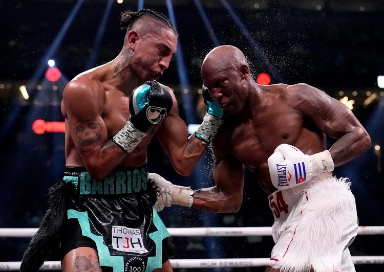 Mario grabs WBC welterweight title 1 - Egyptian Gazette Yordenis Ugas (R) fights Mario Barrios in a welterweight boxing match in Las Vegas.