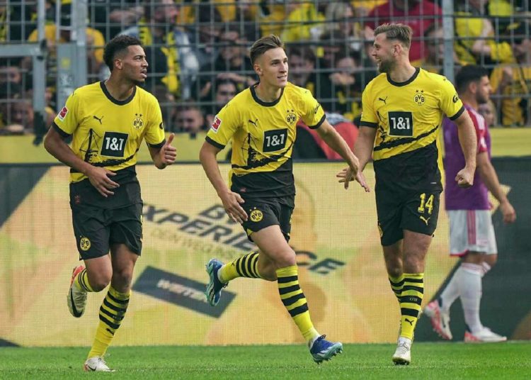 Dortmund's players celebrate after scoring during the German Bundesliga match against Union Berlin in Dortmund.