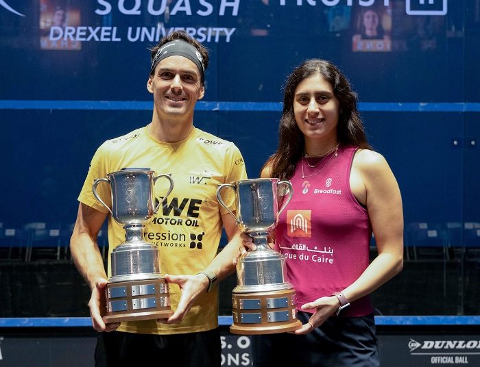 Nour el-Sherbini (R) and Paul Coll pose with their US squash Open titles.