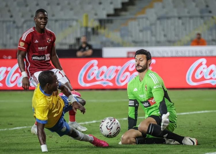 Al-Ahly’s goalkeeper Mohamed el-Shenawy makes a save against Ismaili’s Togolese striker Yaw Annor.