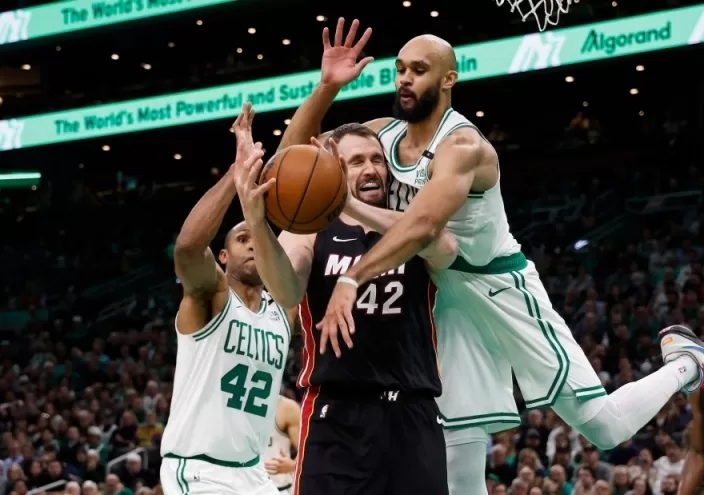 Celtics beat Heat while Wembanyama gets first NBA win 1 - Egyptian Gazette Boston Celtics guard Derrick White (9) jumps in to try to knock the ball away from Miami Heat forward Kevin Love (42) during the second half at TD Garden.