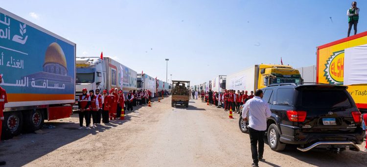 Trucks carrying humanitarian aid waiting to cross into Gaza from Egypt through Rafah.