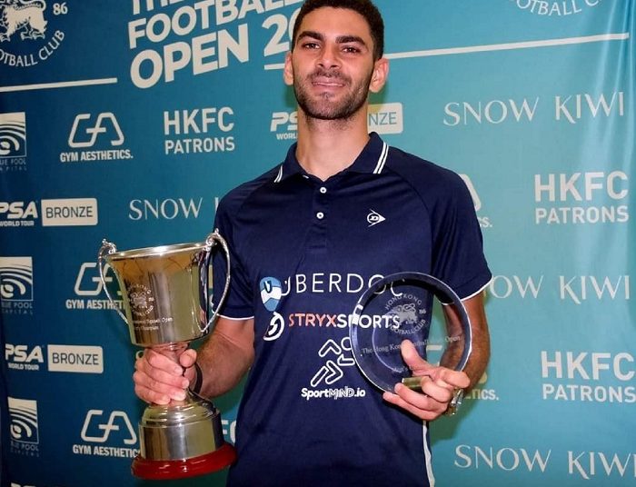 Aly Abou Eleinen poses with the Hong Kong Football Club Squash Open trophy.