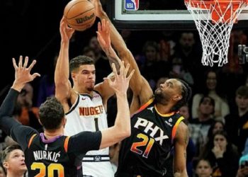 Magic holds off Wizards 130-125