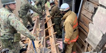 Japan quake: Survivors face freezing rain, threat of landslides