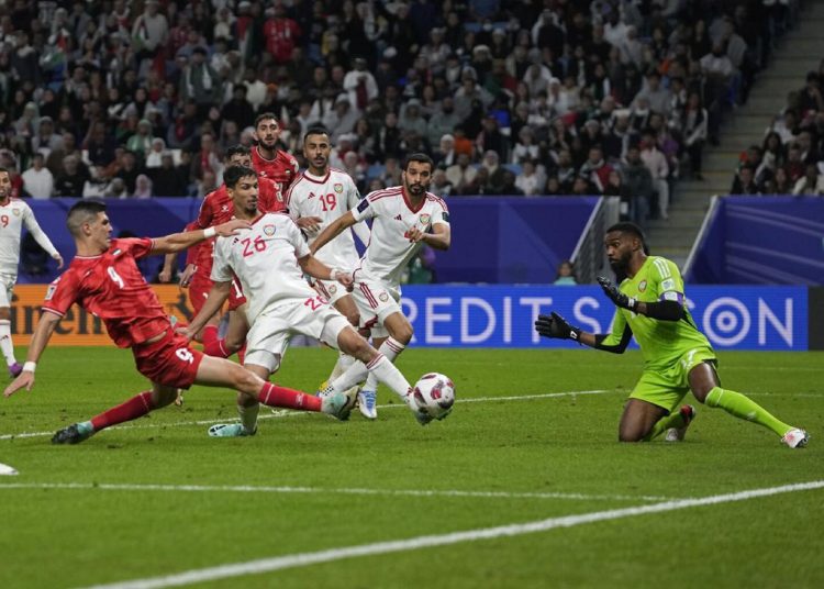 Palestine frustrated by UAE at Asian Cup 1 - Egyptian Gazette Palestine's Tamer Seyam (1st L) shoots in an attempt to score during the Asian Cup Group C match against United Arab Emirates.