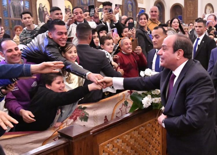 President shakes hands with Christians at new capital's cathedral 1 - Egyptian Gazette