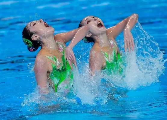 China wins 3 golds at Aquatic worlds 1 - Egyptian Gazette Wang Liuyi and Wang Qianyi, of China compete in the artistic swimming at the World Aquatics Championships in Doha.
