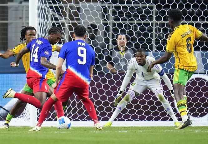 US, Mexico collide in CONCACAF final 1 - Egyptian Gazette United States' Haji Wright (14) prepares to shoot a goal against Jamaica's goalkeeper Andre Blake (1) during the CONCACAF Nations League semi-finals match, in Arlington, Texas.