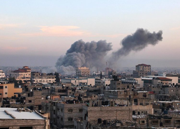 This picture taken in Rafah in the southern Gaza Strip shows smoke rising after an Israeli strike on December 3, 2023, amid continuing battles between Israel and the militant group Hamas. Israel carried out deadly bombardments in Gaza on December 3 as international calls mounted for greater protection of civilians and the renewal of an expired truce with Palestinian militant group Hamas. (Photo by SAID KHATIB / AFP)