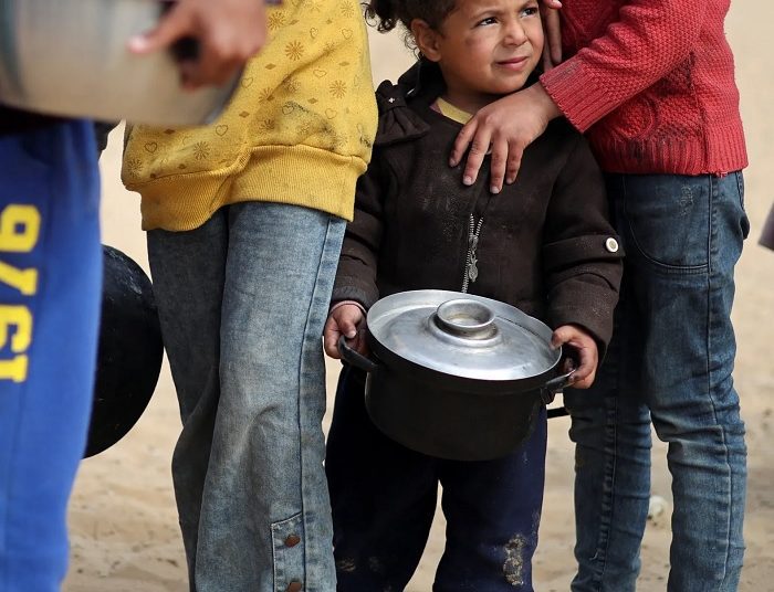 Northern Gaza still heading toward famine, says deputy WFP chief 1 - Egyptian Gazette Displaced Palestinian children wait to receive food at a tent camp in Rafah in the southern Gaza Strip, February 27, 2024. Reuters
