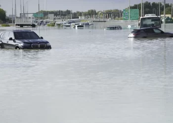 A storm dumps record rain across the desert nation of UAE and floods the Dubai airport