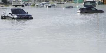 A storm dumps record rain across the desert nation of UAE and floods the Dubai airport