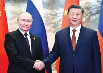 Putin, in China, says US sanctions undermine confidence in dollar