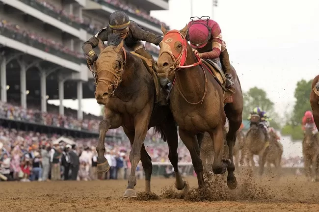 Gaffalione fined $2,500 for Derby ride 1 - Egyptian Gazette Jockey Tyler Gaffalione (L) reaches toward Ryusei Sakai as they head to the finish line in the 150th running of the Kentucky Derby horse race.