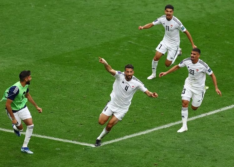 Iraqi football players celebrate scoring first goal against Jordan at Khalifa International Stadium, Al-Rayyan, Qatar on January 29, 2024.