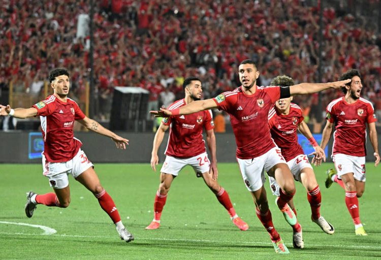 Captain Ramy Rabia (C) leads Al Ahly celebrations after a fourth-minute goal against Esperance in the CAF Champions League final in Cairo.