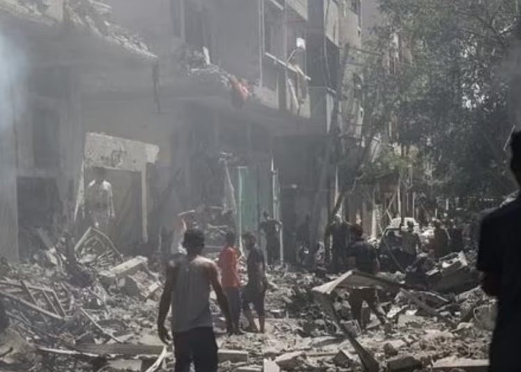 Egypt decries Israel's assaults on Nuseirat Refugee Camp in central Gaza 1 - Egyptian Gazette Palestinians walk on the rubble of destroyed buildings following an operation by Israeli forces in the Nuseirat refugee camp, central Gaza