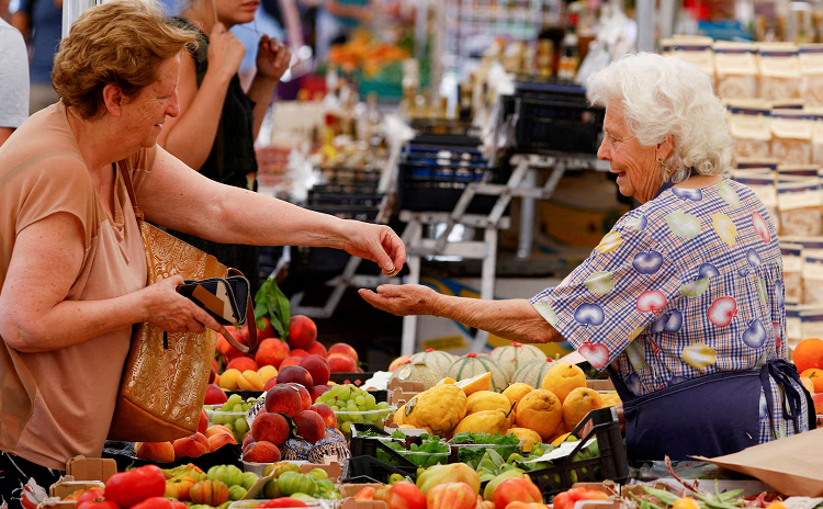 A file photo shows a woman shops at Campo de' Fiori market in Rome, Italy.