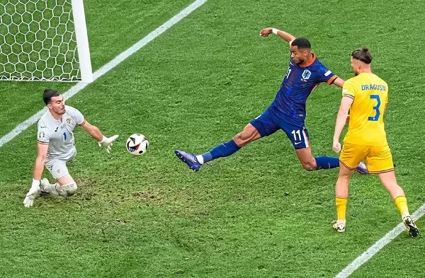 Cody Gakpo of the Netherlands shoots against Romania's goalkeeper Florin Nita at the Euro 2024 in Munich on July 2, 2024.