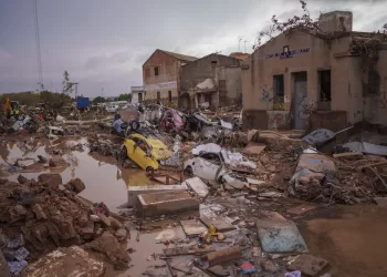 Heavy rains in Barcelona disrupt rail service as troops search for more flood victims in Valencia