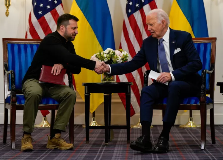 U.S. President Joe Biden shakes hands with Ukrainian President Volodymyr Zelenskiy in Paris, France, June 7, 2024. REUTERS/Elizabeth Frantz  REFILE - QUALITY REPEAT