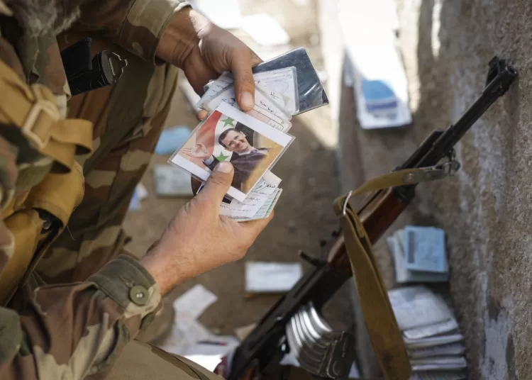 Iraq sends nearly 2,000 Syrian soldiers back home 1 - Egyptian Gazette epa11781524 A syrian soldier searches for missing relatives outside the Mezzeh Air Base on the outskirts of Damascus, Syria, 16 December 2024. After Syrian rebels ousted President Bashar al-Assad on 08 December 2024, the Israeli military carried out strikes throughout Syria to destroy what remained of the Assad regime's military arsenal. EPA/ANTONIO PEDRO SANTOS