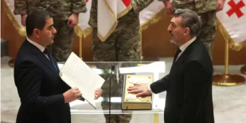 New Georgian president sworn in; predecessor says he is not legitimate leader