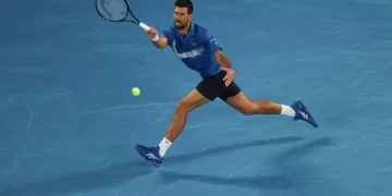 Djokovic breaks Federer’s Slam record with gritty Melbourne win