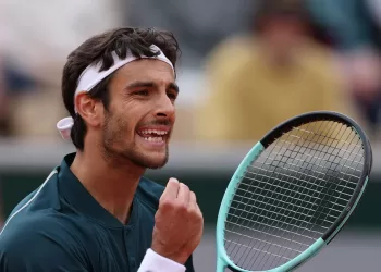 Big names crash but Italians shine on damp day at French Open