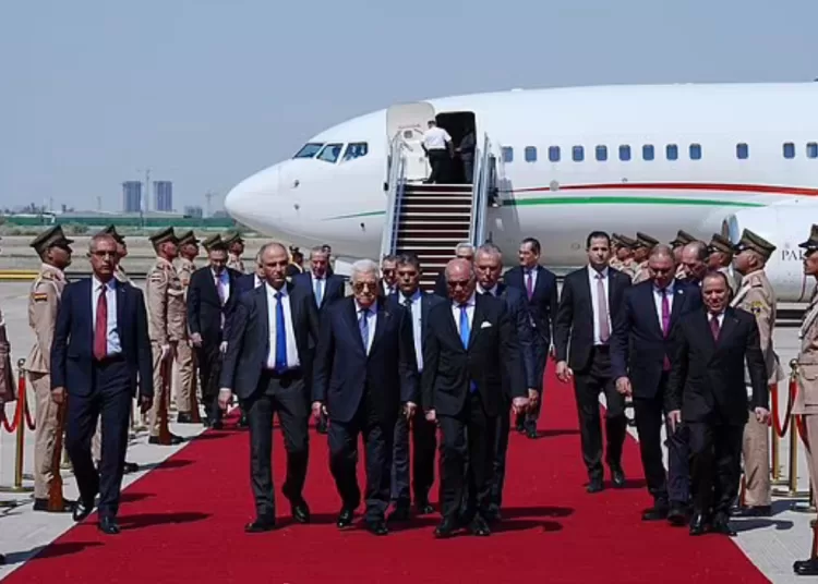 raqi Foreign Minister Fuad Hussein, center right, welcomes Palestinian President Mahmoud Abbas upon arrival at Baghdad International Airport ahead of the 34th Arab League summit, in Baghdad