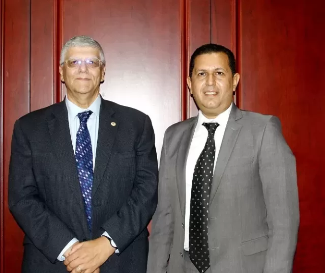 Editor-in-Chief of the Gazette Mohamed Fahmy (R) and Dr Amr Adly