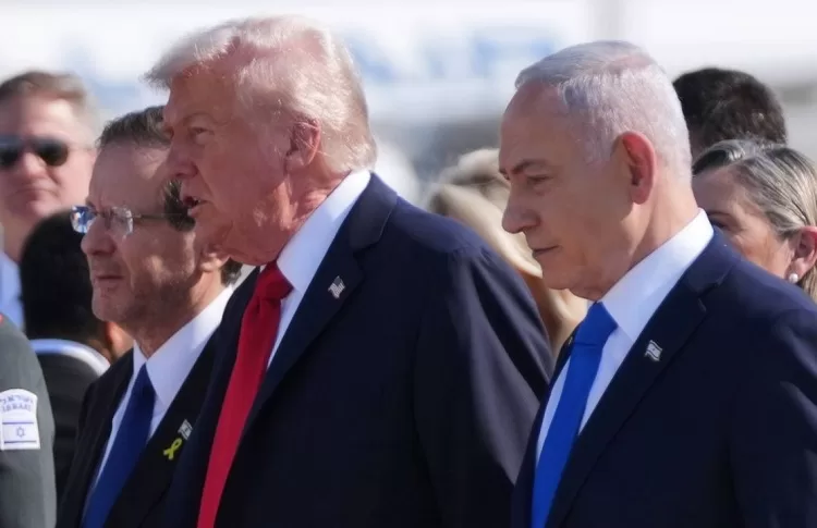 President Donald Trump walks with Israel's Prime Minister Benjamin Netanyahu during an arrival ceremony at Ben Gurion International Airport, Monday, Oct. 13, 2025, near Tel Aviv.