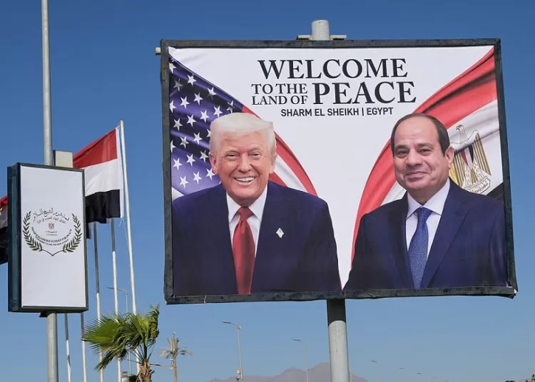 This photograph shows a billboard bearing the portraits of US President Donald Trump and Egyptian President Abdel Fattah al-Sisi outside the convention centre ahead of the Sharm el-Sheikh Peace Summit in the Egyptian Red Sea resort town of Sharm el-Sheikh on October 13, 2025. AFP
