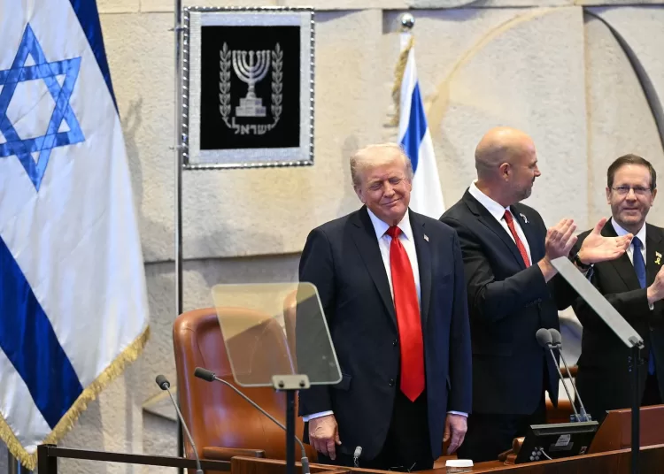 Trump addresses Knesset after declaring Gaza war ‘over’ 1 - Egyptian Gazette President Donald Trump reacts as he receives a standing ovation before speaking at the Israeli parliament, the Knesset, in Jerusalem on Oct. 13, 2025. Getty images