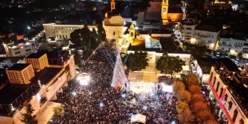 Bethlehem lights its tree for 1st time since Gaza war 1 - Egyptian Gazette Bethlehem lights its tree for 1st time since Gaza war