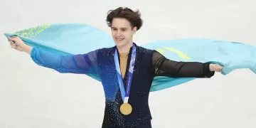 Mikhail claims Olympic skating title