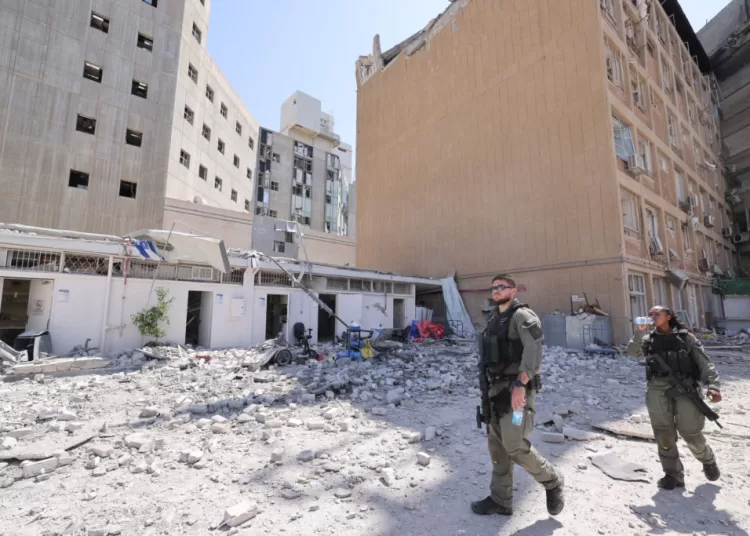 Iranian hospital, tourist site damaged in strikes 1 - Egyptian Gazette Members of the Israeli security forces walk at the Soroka Medical Center, the city's general hospital, at an impact site following a missile strike from Iran on Israel, in Beersheba, Israel on 19 June 2025. Marc Israel Sellem/Pool via REUTERS