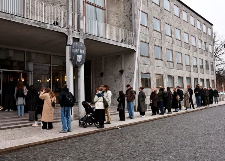 Voters queue outside Aarhus City Hall on the day of the parliamentary election in Aarhus, Denmark March 24, 2026.