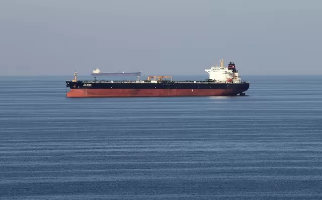 Oil jumps 10% on Iran conflict, could hit $100 1 - Egyptian Gazette Oil tankers pass through the Strait of Hormuz, December 21, 2018. REUTERS