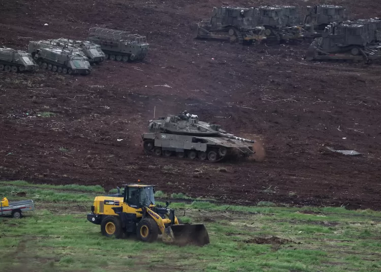 Israeli military vehicles at the Israeli side of the Israel-Lebanon border, amid escalation between Hezbollah and Israel, and amid the U.S.-Israeli conflict with Iran, in northern Israel, March 15, 2026. REUTERS