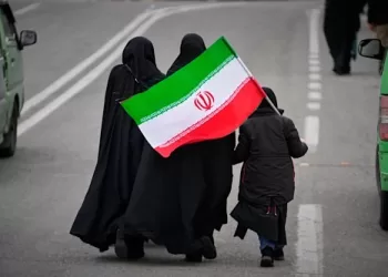 Iran warns of strikes on tourist sites, keeps missile work going