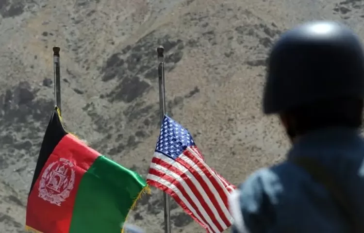 The image shows flags of Afghanistan and the United States. — AFP/File