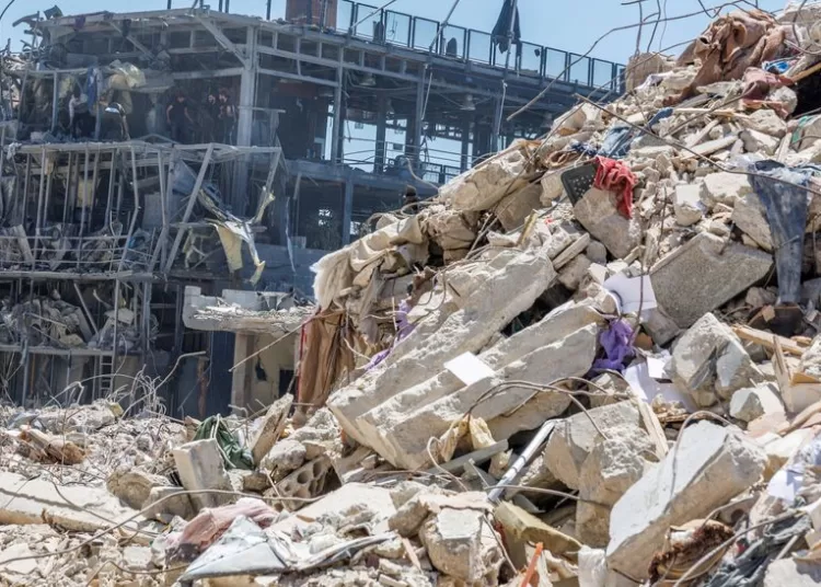 Workers clean a restaurant that was damaged by an Israeli strike, amid a temporary ceasefire between Lebanon and Israel, in Tyre, Lebanon, April 23, 2026. REUTERS/Zohra Bensemra/File Photo