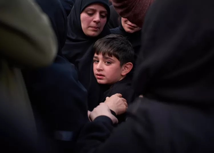 Mohammed, 8, cries next to the coffin of his father, Hussein Makkah, during the funeral of 13 state security officers killed the previous day in an Israeli strike in Lebanon’s coastal city of Sidon, Lebanon, Saturday, April 11, 2026. (AP Photo/Emilio Morenatti)