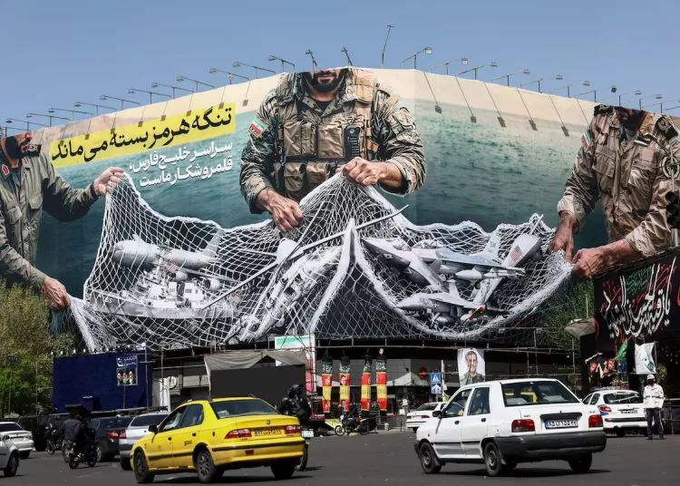 Cars drive near an anti-U.S. bilboard, amid the U.S.-Israeli conflict with Iran, in Tehran, Iran, April 5, 2026. Majid Asgaripour/WANA (West Asia News Agency